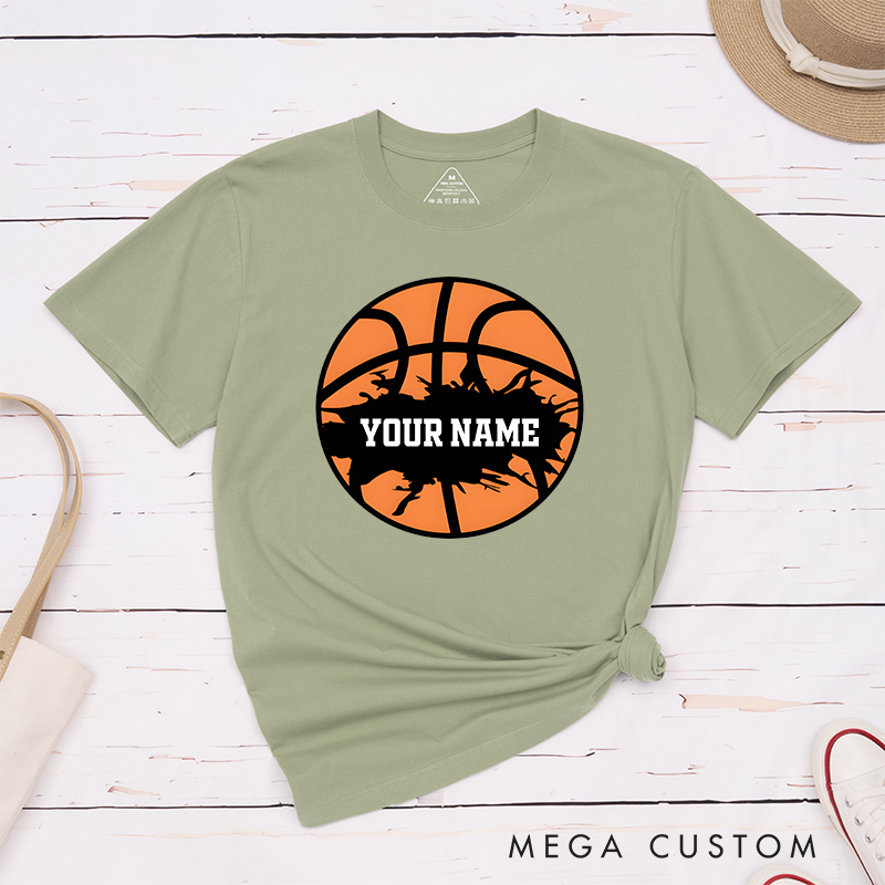 Personalized Basketball T-Shirt Design Featuring Bold Orange Basketball Graphic with Splatter Effect and Customizable Name