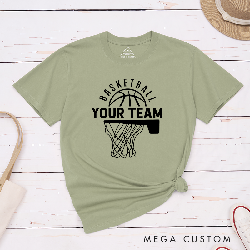 Personalized Basketball T-Shirt Design Showcasing Custom Team Name Bold Basketball Graphic Dynamic Hoop and Net Illustration and Stylish Arched Text Layout