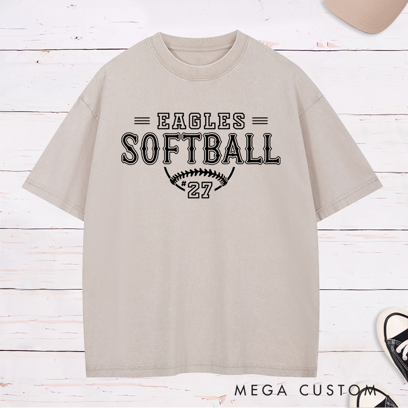 Personalized Softball Washed T-Shirt Featuring a Customizable Team Name Player Number Vintage-Inspired Typography and a Softball Stitch Graphic