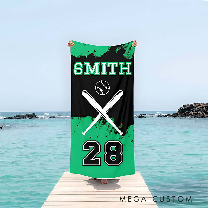 Personalized baseball beach towel featuring a custom name jersey number crossed bats and a baseball graphic perfect for sports enthusiasts and beach lovers