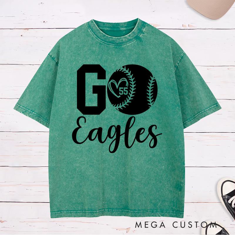 Personalized Softball Spirit Washed T-Shirt Design Featuring Bold "Go" Text Team Name in Elegant Script Heart-Shaped Player Number Inside a Softball Graphic Perfect for Fans and Players