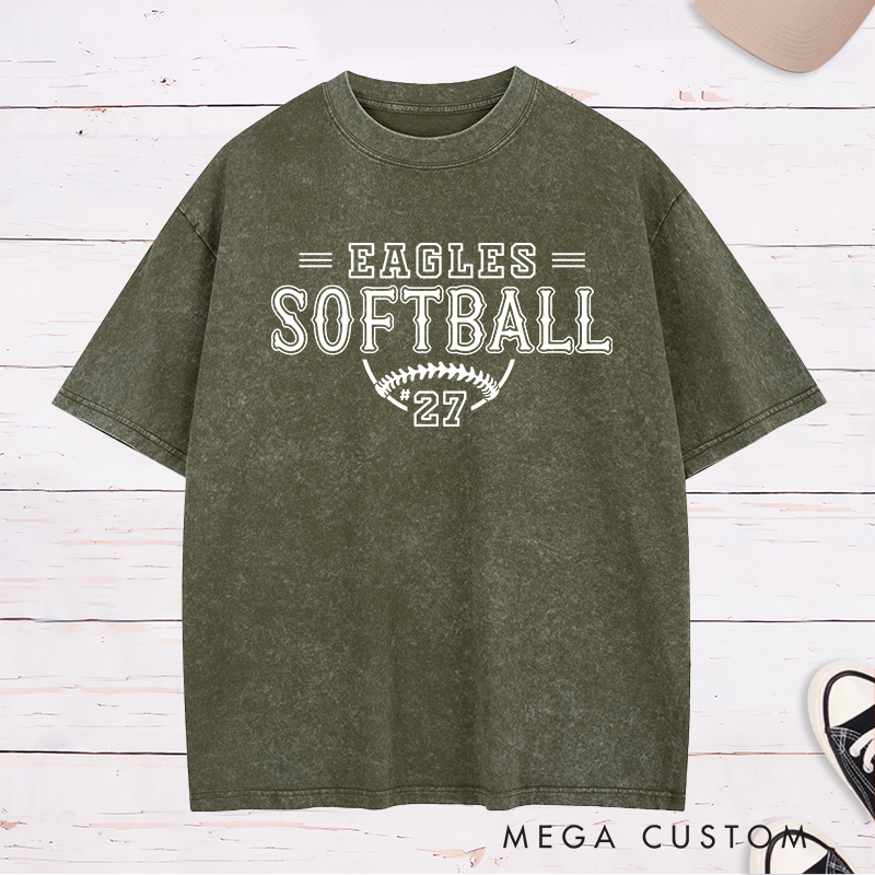 Personalized Softball Washed T-Shirt Featuring a Customizable Team Name Player Number Vintage-Inspired Typography and a Softball Stitch Graphic