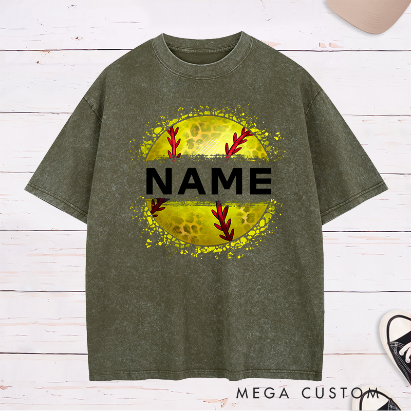 Personalized Softball Washed T-Shirt Design Featuring Custom Name Displayed Boldly Across a Distressed Softball Graphic with Textured Details
