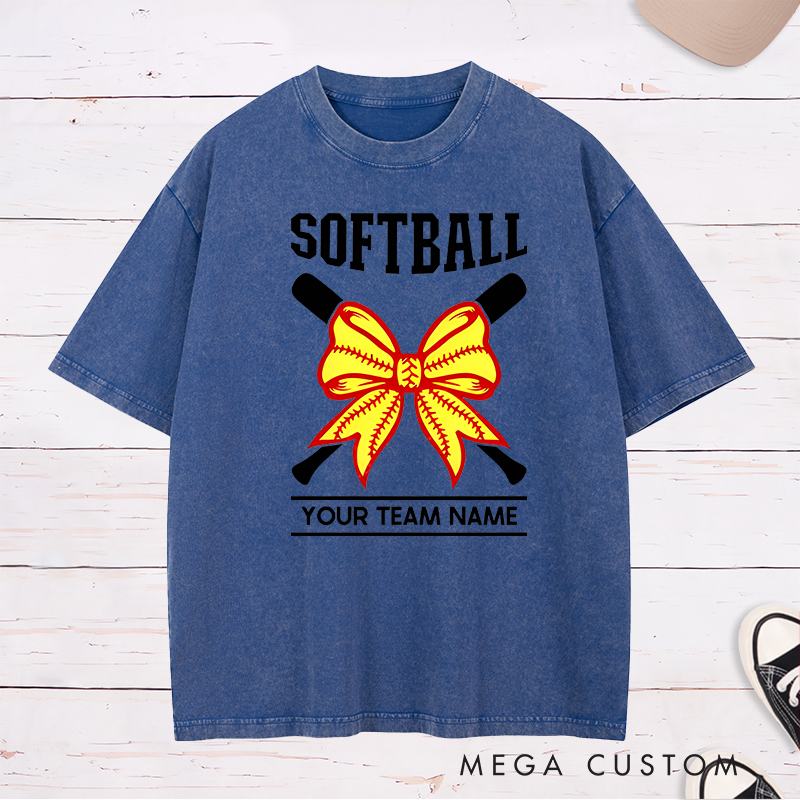 Personalized Softball Team Washed T-Shirt Design Featuring Customizable Team Name Striking Softball Bow Graphic and Crossed Bats