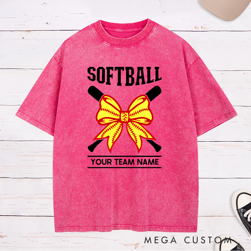 Personalized Softball Team Washed T-Shirt Design Featuring Customizable Team Name Striking Softball Bow Graphic and Crossed Bats