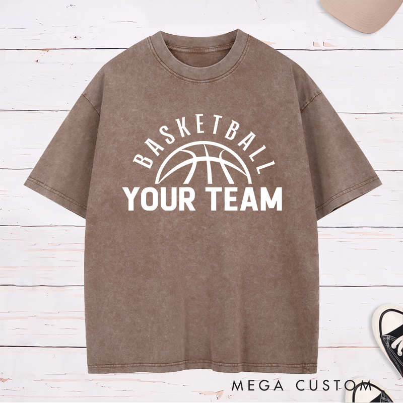 Personalized Washed T-Shirt Design Featuring a Clean Basketball Graphic with a Customizable Team Name Below an Arched Basketball Text