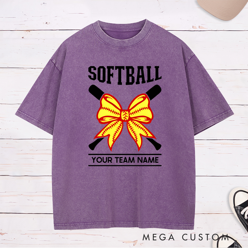 Personalized Softball Team Washed T-Shirt Design Featuring Customizable Team Name Striking Softball Bow Graphic and Crossed Bats