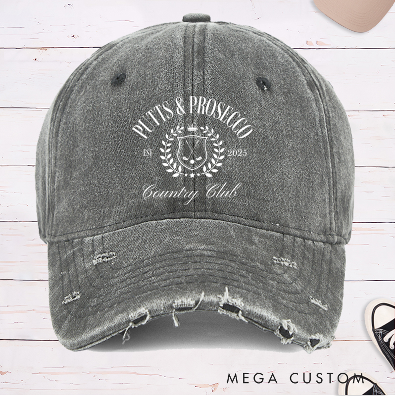 Personalized Distressed Denim Baseball Cap with "Putts & Prosecco" Country Club Laurel Crest Design and Custom EST Year