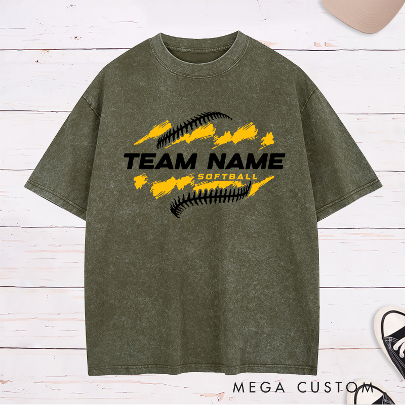Personalized Softball Team Washed T-Shirt Design Featuring Customizable Team Name Bold Text Dynamic Brushstroke Elements and Softball Stitch Graphics