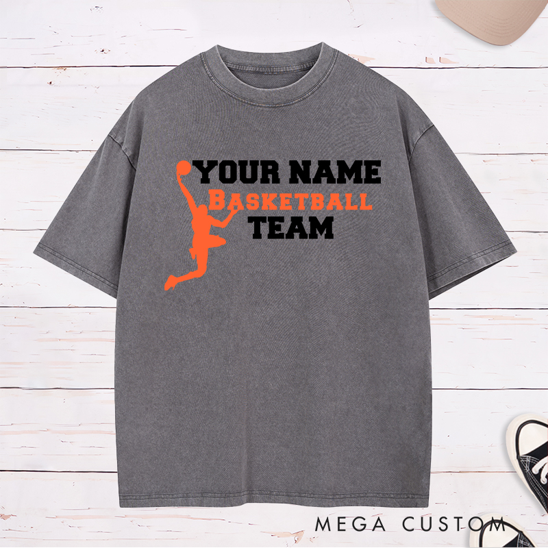 Personalized Basketball Team Washed T-Shirt Design Featuring a Dynamic Dunking Player Silhouette with Customizable Team Name for a Bold and Unique Look