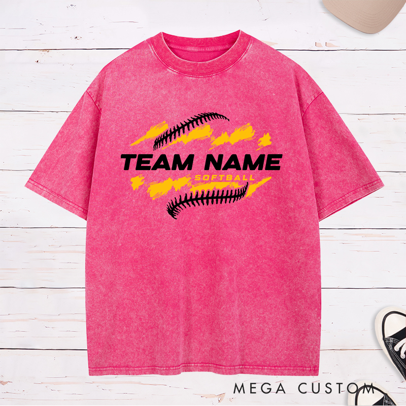 Personalized Softball Team Washed T-Shirt Design Featuring Customizable Team Name Bold Text Dynamic Brushstroke Elements and Softball Stitch Graphics