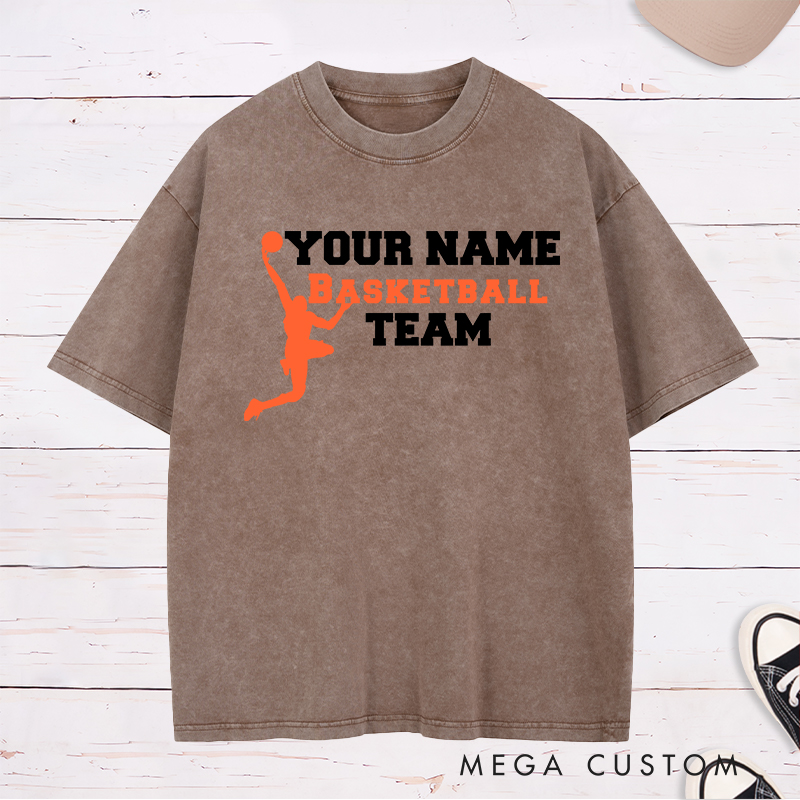 Personalized Basketball Team Washed T-Shirt Design Featuring a Dynamic Dunking Player Silhouette with Customizable Team Name for a Bold and Unique Look