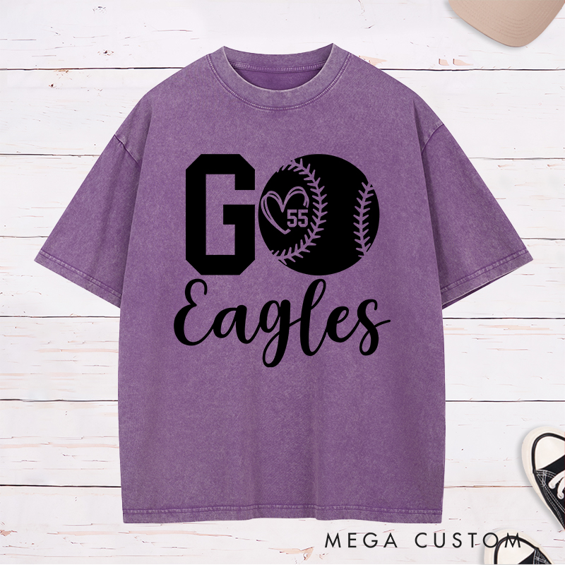 Personalized Softball Spirit Washed T-Shirt Design Featuring Bold "Go" Text Team Name in Elegant Script Heart-Shaped Player Number Inside a Softball Graphic Perfect for Fans and Players