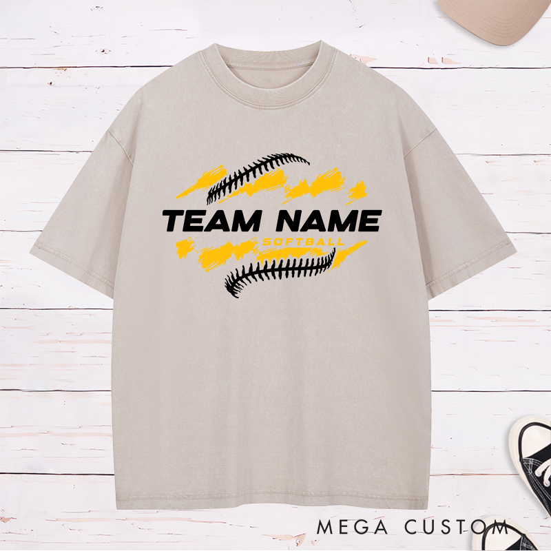 Personalized Softball Team Washed T-Shirt Design Featuring Customizable Team Name Bold Text Dynamic Brushstroke Elements and Softball Stitch Graphics