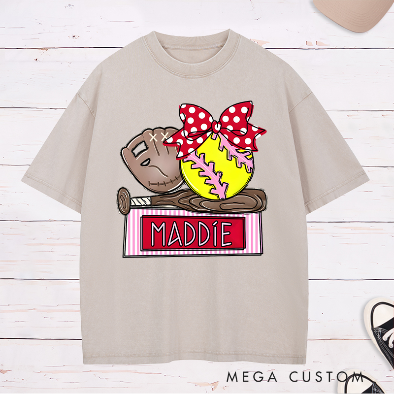 Personalized Softball Washed T-Shirt Design Featuring Custom Name Bright Softball Graphic and Playful Bow Accent