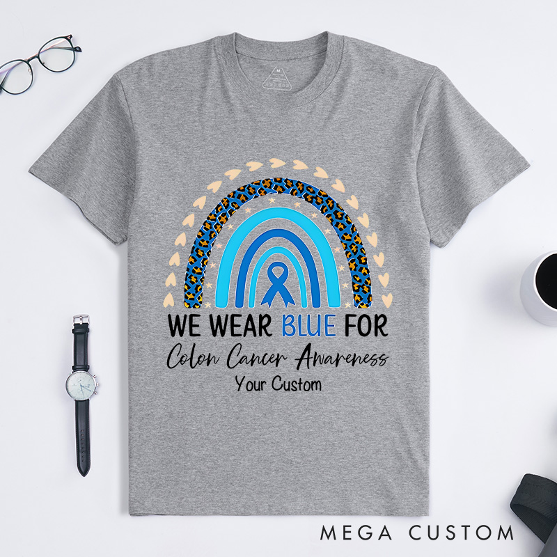 Personalized We Wear Blue Rainbow and Ribbon Design Supporting Colon Cancer Awareness and Unity T-shirt
