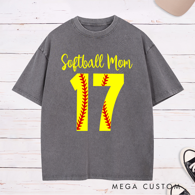Personalized Softball Mom Washed T-Shirt Design Featuring Customizable Player Number with Red Stitch Softball Pattern and Stylish Yellow Script Text
