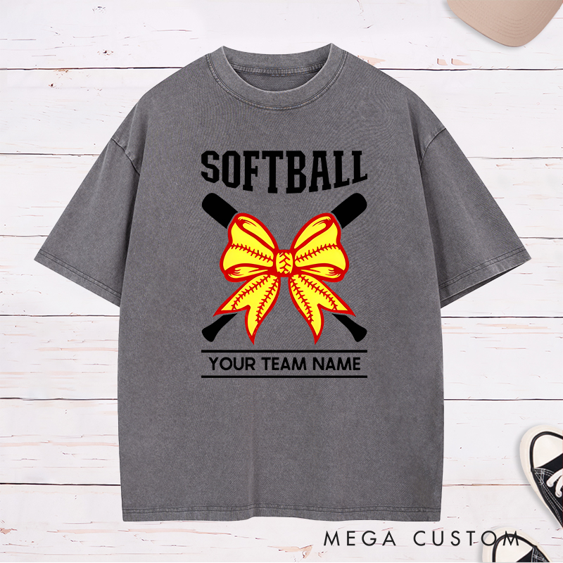 Personalized Softball Team Washed T-Shirt Design Featuring Customizable Team Name Striking Softball Bow Graphic and Crossed Bats