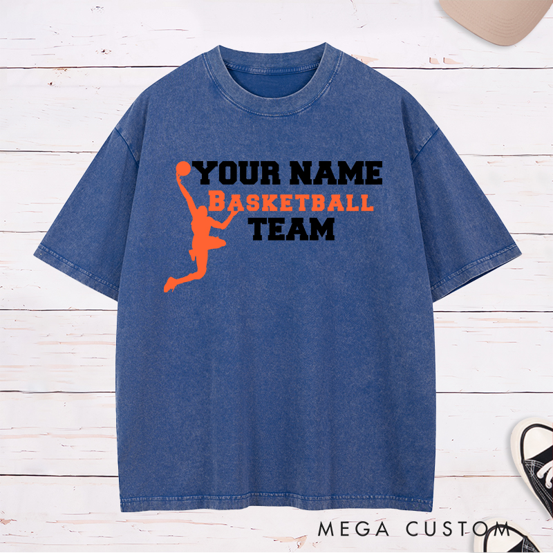 Personalized Basketball Team Washed T-Shirt Design Featuring a Dynamic Dunking Player Silhouette with Customizable Team Name for a Bold and Unique Look