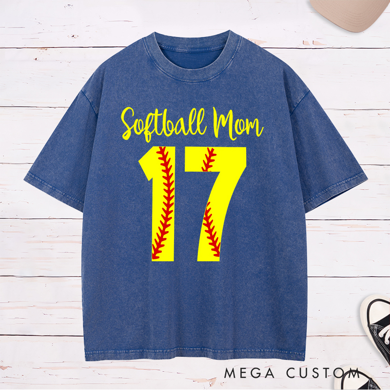 Personalized Softball Mom Washed T-Shirt Design Featuring Customizable Player Number with Red Stitch Softball Pattern and Stylish Yellow Script Text