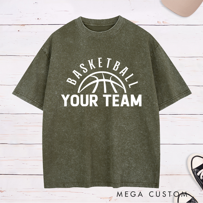 Personalized Washed T-Shirt Design Featuring a Clean Basketball Graphic with a Customizable Team Name Below an Arched Basketball Text
