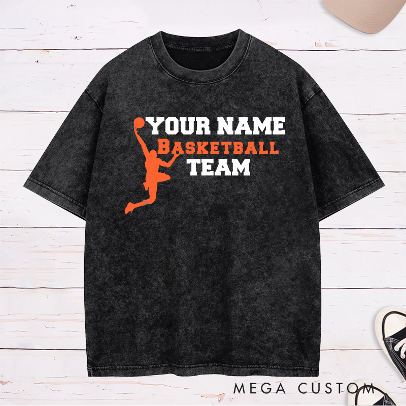 Personalized Basketball Team Washed T-Shirt Design Featuring a Dynamic Dunking Player Silhouette with Customizable Team Name for a Bold and Unique Look
