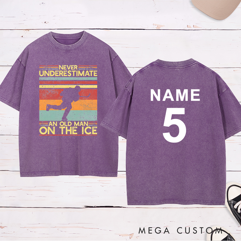 Personalized "Never Underestimate an Old Man on the Ice" Hockey Washed T-Shirt with Custom Name and Number