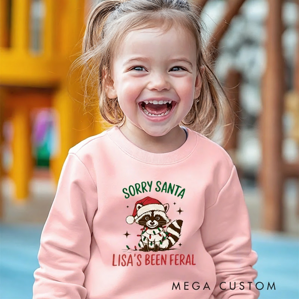 Personalized Kids Sweatshirt and Holiday Pullover with Funny Raccoon and Santa Christmas Design Featuring Festive Cartoon Elements for a Playful Winter Look