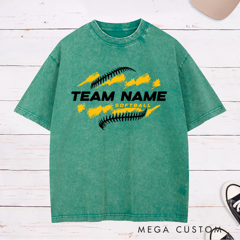 Personalized Softball Team Washed T-Shirt Design Featuring Customizable Team Name Bold Text Dynamic Brushstroke Elements and Softball Stitch Graphics