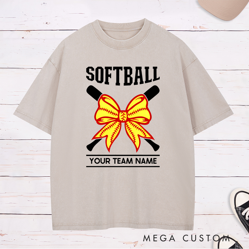 Personalized Softball Team Washed T-Shirt Design Featuring Customizable Team Name Striking Softball Bow Graphic and Crossed Bats