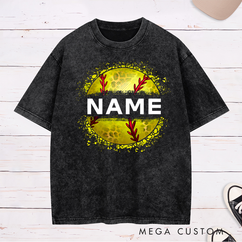 Personalized Softball Washed T-Shirt Design Featuring Custom Name Displayed Boldly Across a Distressed Softball Graphic with Textured Details
