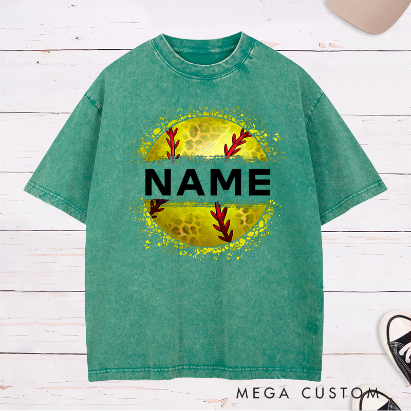Personalized Softball Washed T-Shirt Design Featuring Custom Name Displayed Boldly Across a Distressed Softball Graphic with Textured Details