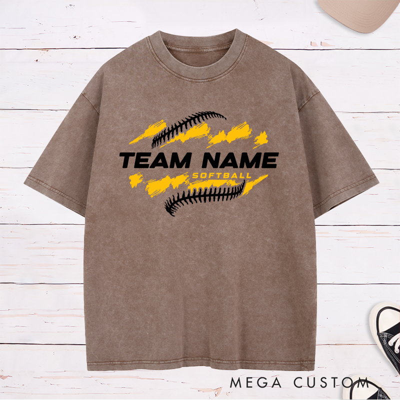 Personalized Softball Team Washed T-Shirt Design Featuring Customizable Team Name Bold Text Dynamic Brushstroke Elements and Softball Stitch Graphics