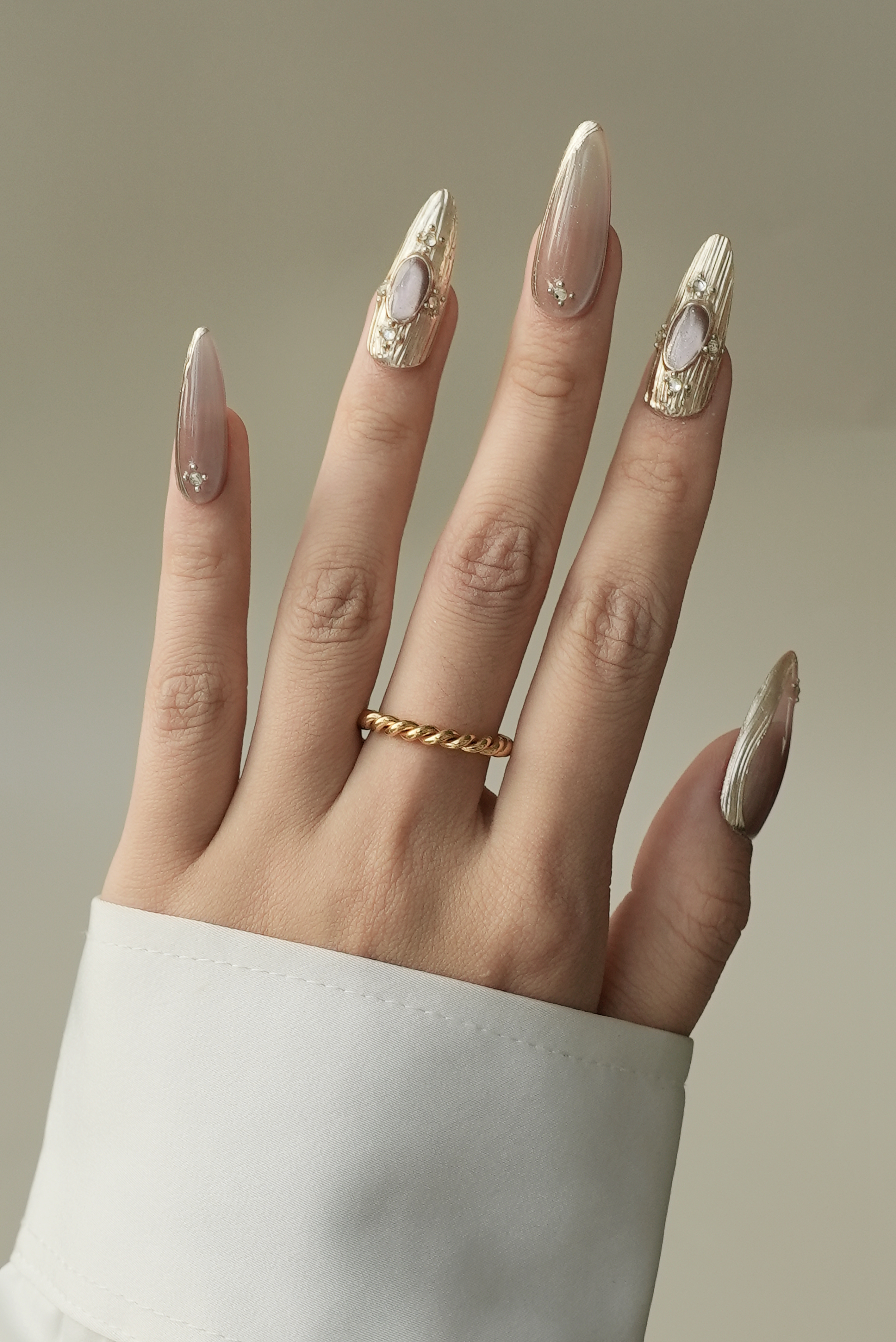 Gold twisted metal ring