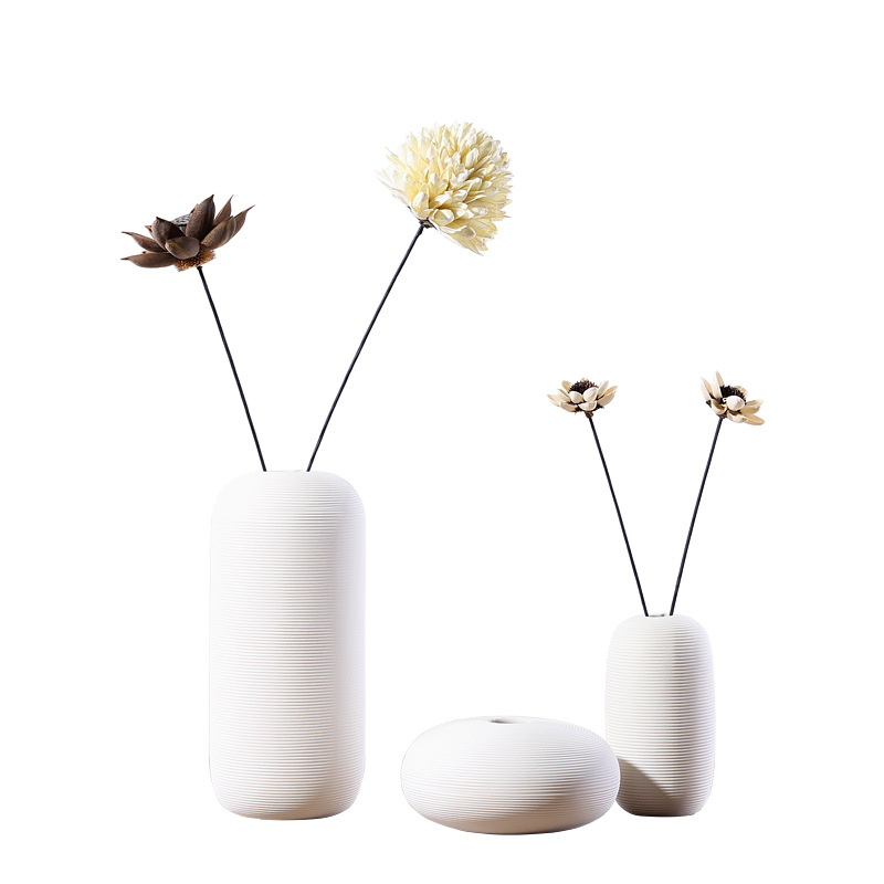 Three-piece set of ceramic white vases as decorative ornaments for living room and home decoration crafts