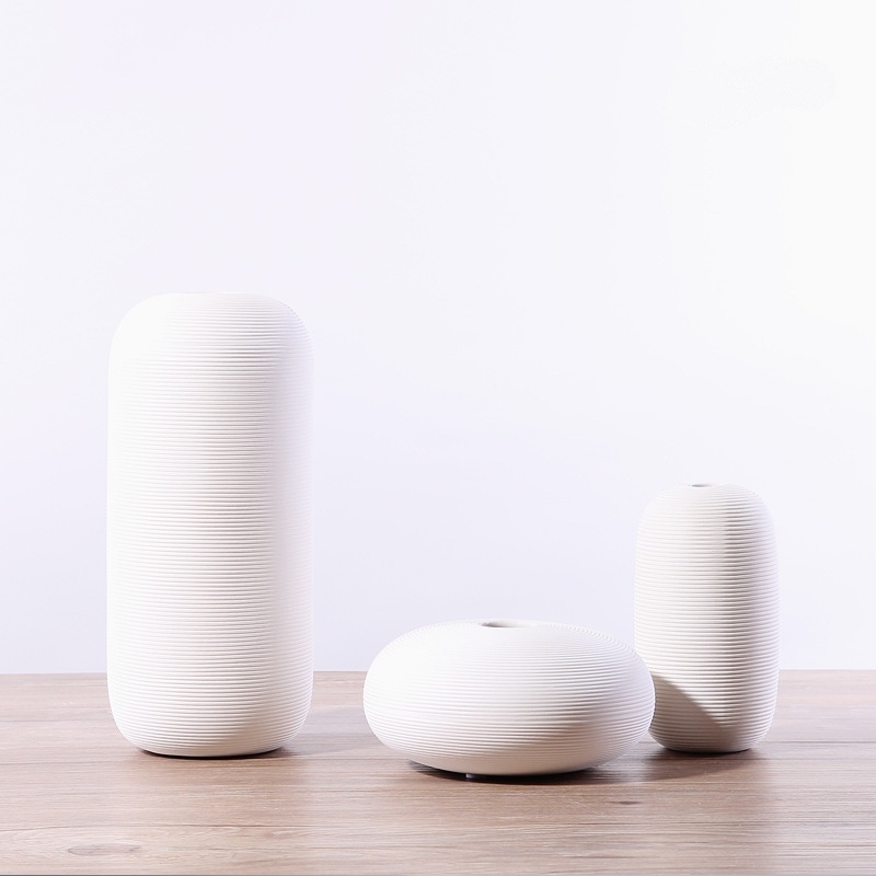 Three-piece set of ceramic white vases as decorative ornaments for living room and home decoration crafts