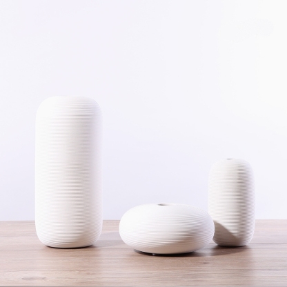 Three-piece set of ceramic white vases as decorative ornaments for living room and home decoration crafts