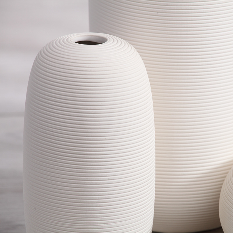 Three-piece set of ceramic white vases as decorative ornaments for living room and home decoration crafts