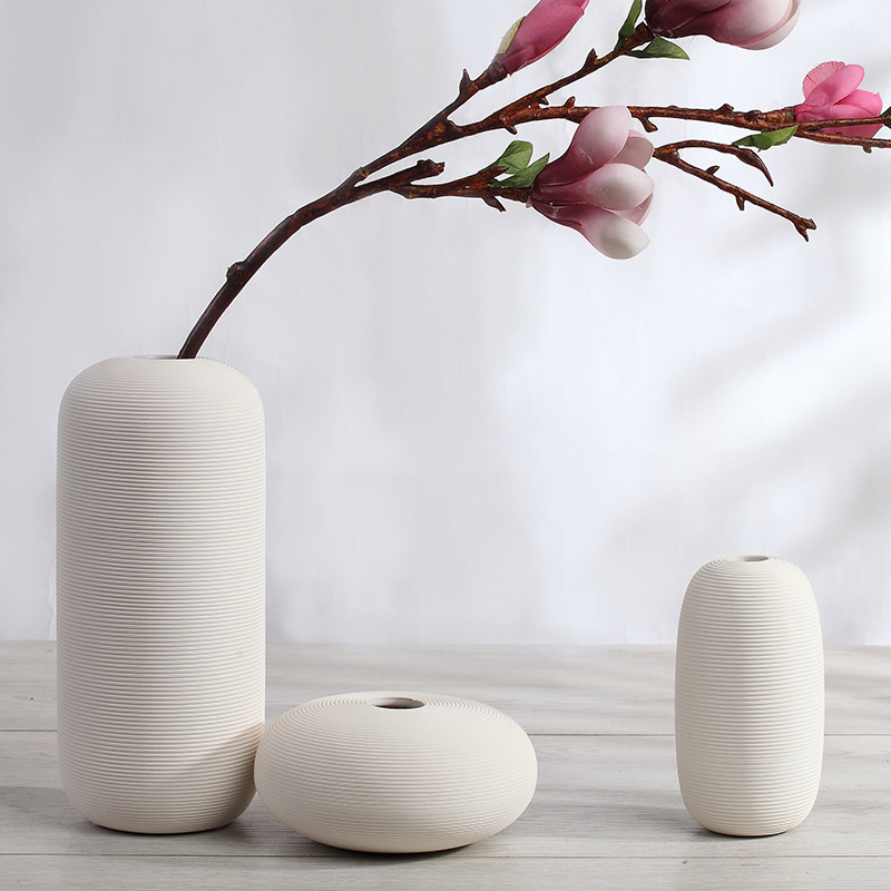 Three-piece set of ceramic white vases as decorative ornaments for living room and home decoration crafts