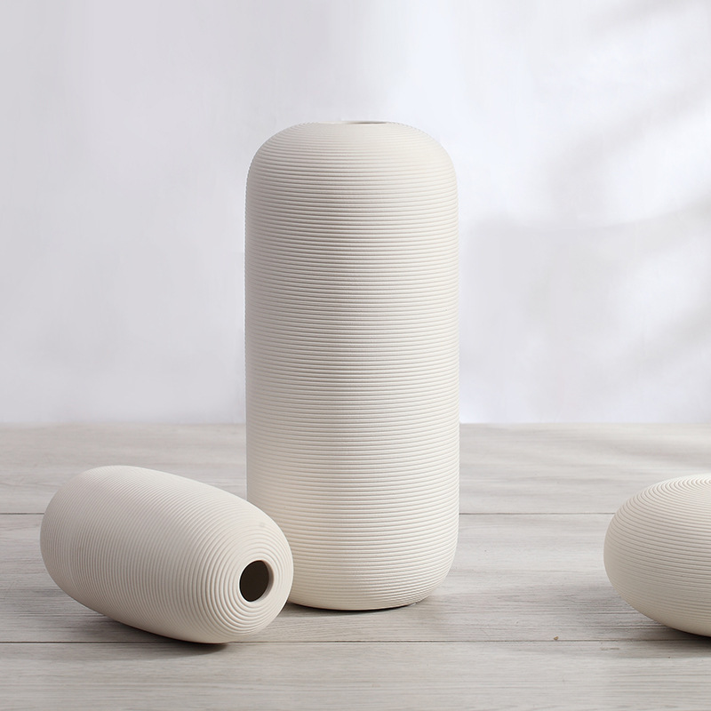 Three-piece set of ceramic white vases as decorative ornaments for living room and home decoration crafts