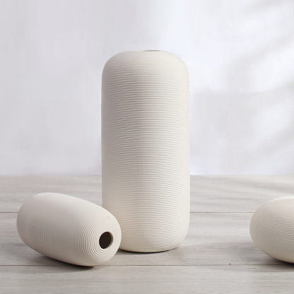 Three-piece set of ceramic white vases as decorative ornaments for living room and home decoration crafts