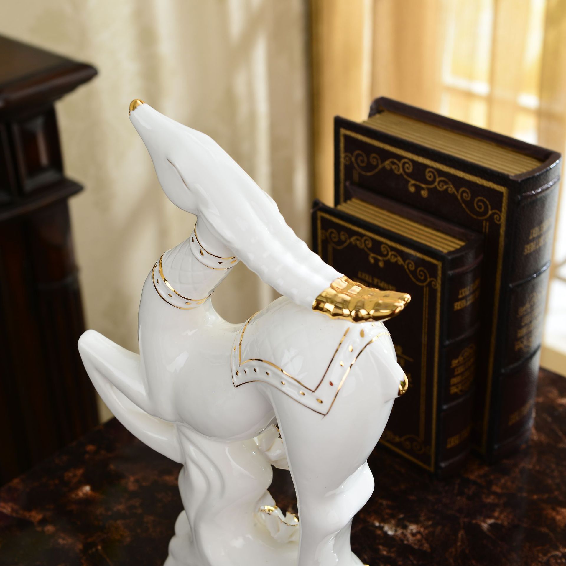 Ceramic sheep figurine, a lucky goat ornament, a craft item for home decoration.