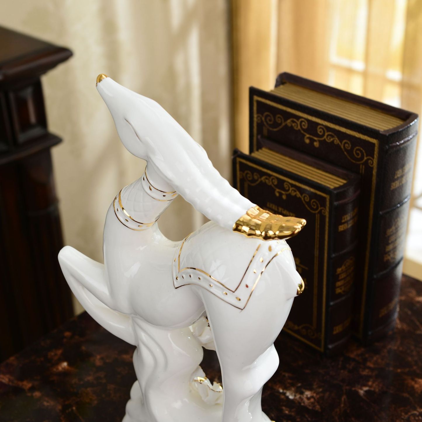 Ceramic sheep figurine, a lucky goat ornament, a craft item for home decoration.