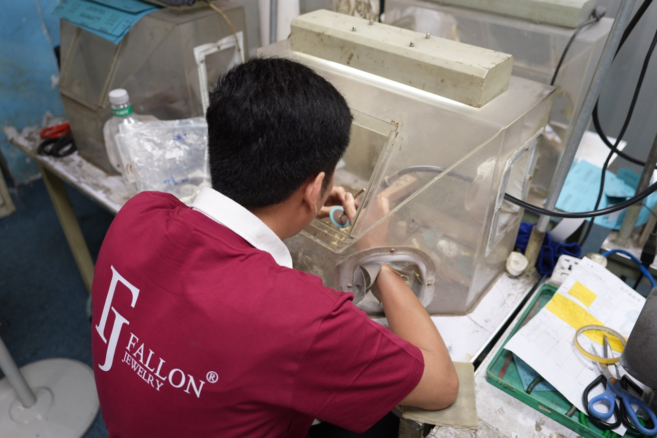 FJ Fallon Jewelry craftsman performing hand polishing and surface finishing