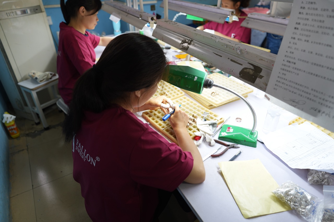 Manual jewelry inspection and sorting at FJ Fallon Jewelry factory