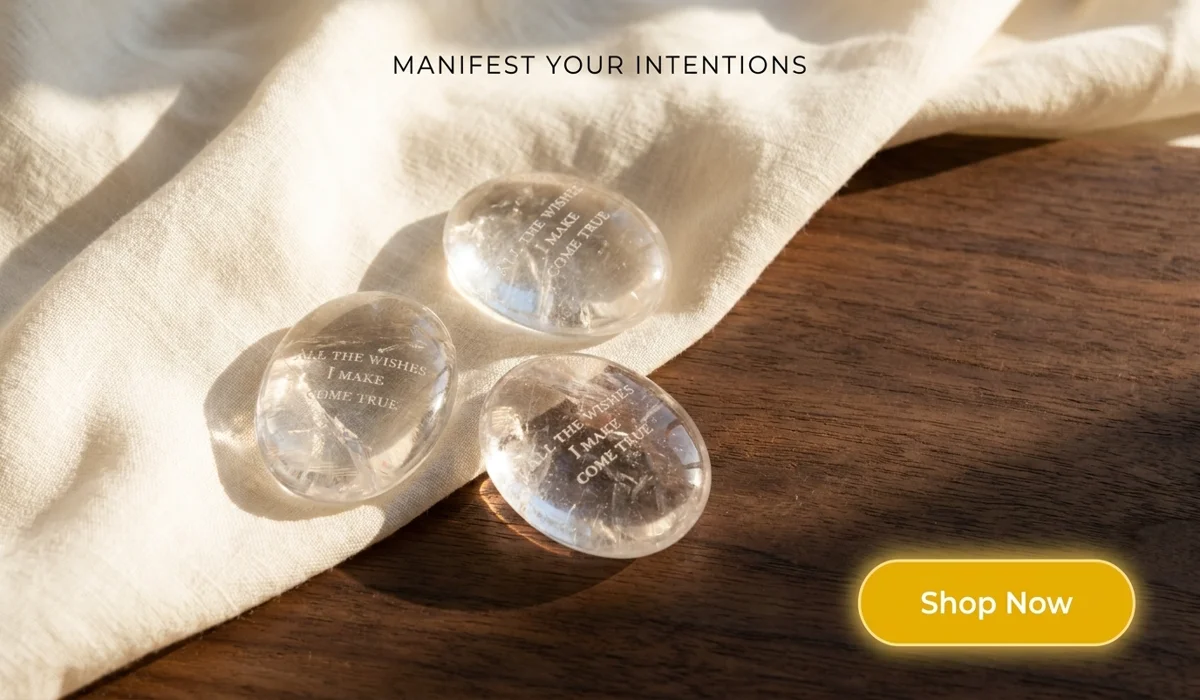 Natural High-Clarity Clear Quartz Palm stone for Meditation with engraved manifestation affirmation on a premium wooden tray