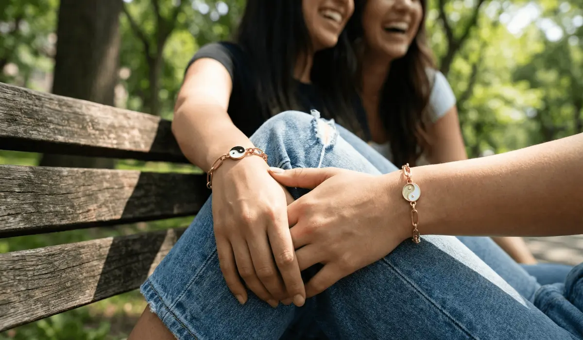 Two best friends sharing a moment while wearing matching handcrafted spiritual bracelets as a symbol of their bond.