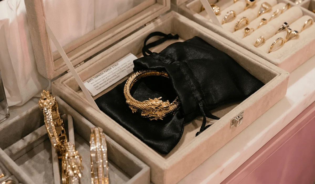 Proper long-term storage for dragon jewelry using a velvet box, silk pouch, and anti-tarnish strips to prevent damage.