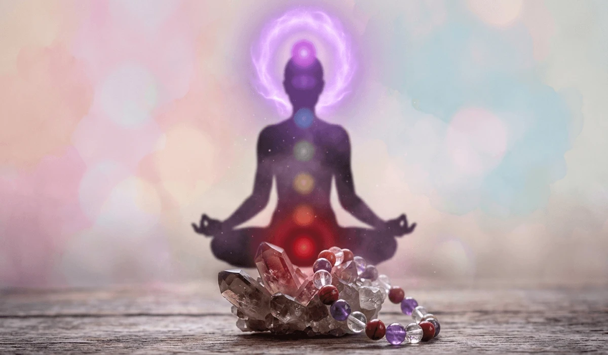 Spiritual illustration of chakra alignment and the symbolic meaning of crystal meditation beads.