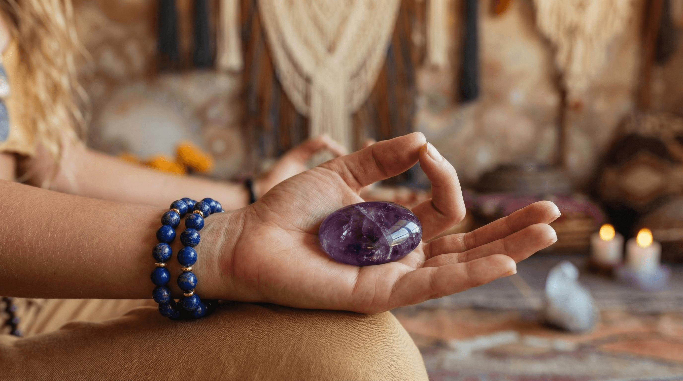 A practitioner wearing Lapis Lazuli jewelry and holding Amethyst during a meditation session for energy alignment.